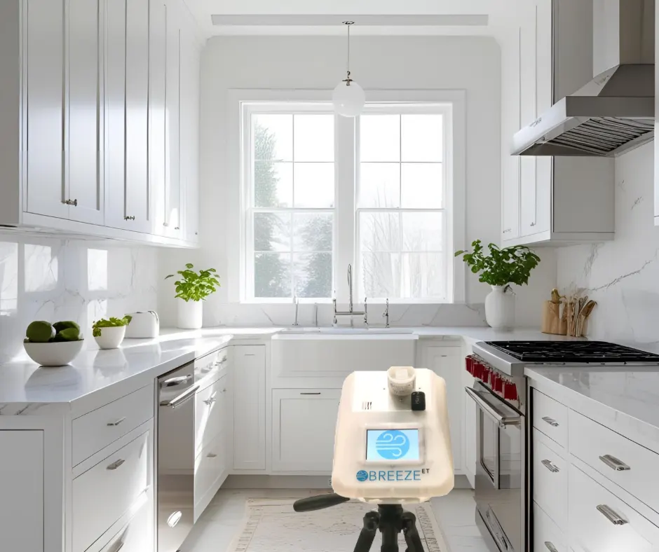 Professional air-sampling pump set up on a tripod in a home kitchen during Specialty Testing